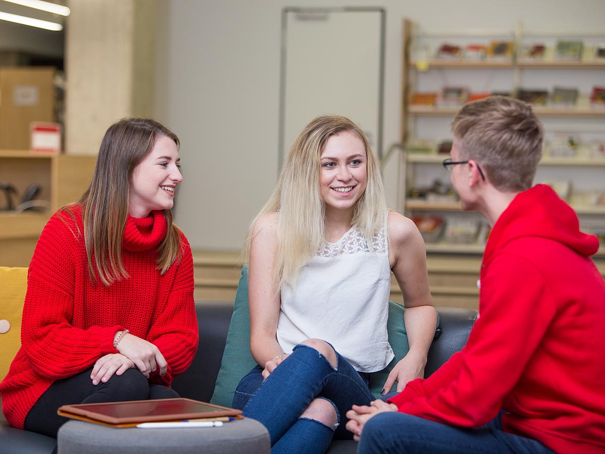 A group of students in conversation.