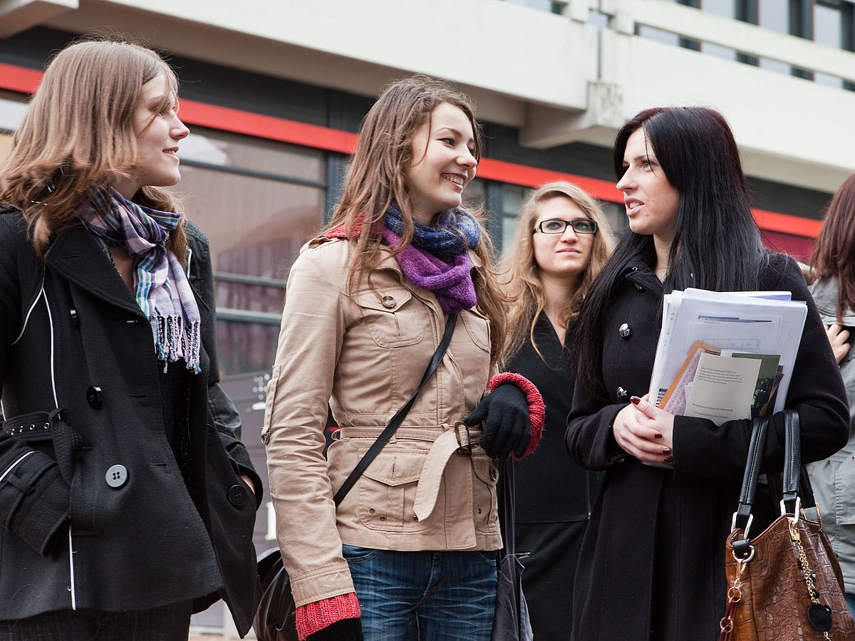 Young women in conversation.