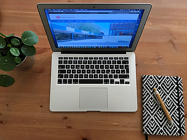 A laptop and a notebook